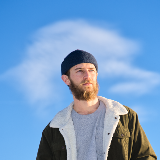 Headshot of Lelan against a blue sky